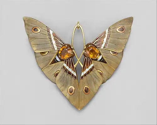 Moth pendant by Lucien Gaillard, of Gold, champlevé enamel, citrines, carved horn;(c. 1900–1902)(Metropolitan Museum)