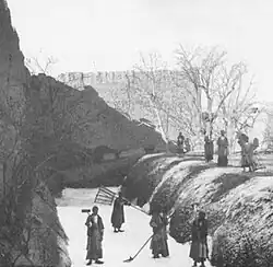 Workers clearing ice from ice pit at a yakhchāl