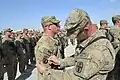 Soldiers with the 1487th Transportation Company-Ohio National Guard earn the Shoulder Sleeve Insignia Former Wartime Service, April 28, at Kandahar Airfield, Afghanistan.