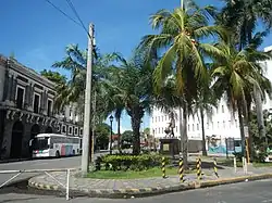Plaza de España is dominated by the statue of King Philip II at the center, with the ruins of the Aduana Building in close proximity.