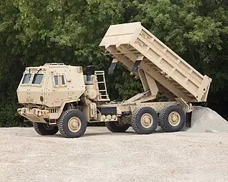 An Oshkosh-produced M1157 A1P2 MTV 10-ton Dump in B-kit configuration