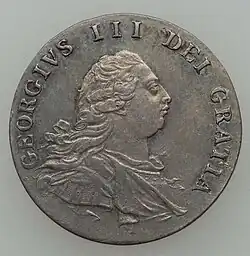 Silver coin showing bust of a man