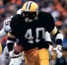 Ivery in uniform rushing the football during a game