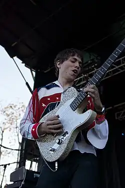 Rado playing an electric guitar