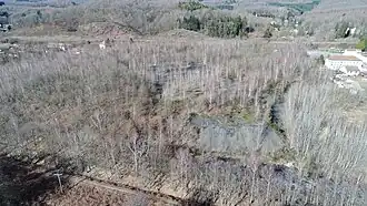 General aerial view of the slag heap, shaft buildings and large offices.