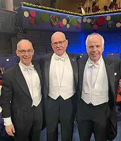 K. Barry Sharpless with collaborators Hartmuth Kolb and M.G. Finn at the 2022 Nobel awards ceremony.