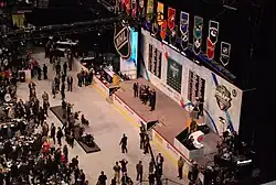 A far away photo of Rakell accepting his jersey