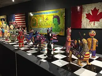 Kirsten Abrahamson and her various ceramic sculptures of robots at Jonathon Bancroft Snell Gallery, October 2015. Photo taken by her loving daughter.