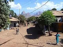 A street in Adi Arkay with a view to the Simien Mountains in the background (Amhara Region, Ethiopia).
