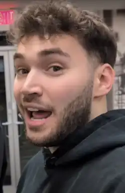 Headshot of Ross, who is facing towards the left