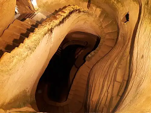 Stairway leading down an ancient quarry Extensive cave dwellings at Tell Maresha