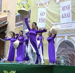 The female students wearing purple Áo dài
