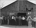 Line up for state relief pay day, Arvin, California, 1940