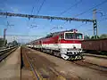 Diesel locomotive with passenger cars at Bánovce nad Ondavou train station