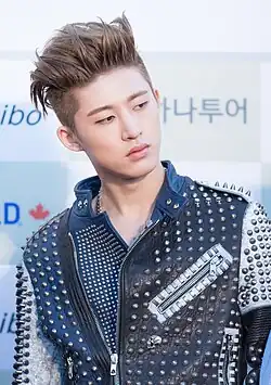Image 33K-pop star B.I sporting an undercut hairstyle, 2016 (from 2010s in fashion)