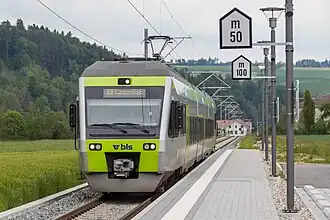 Silver train with green accents