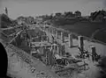 Construction of the foundations of Herisau station; in the background is the village of Herisau with its church.