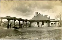 Postcard view of a stone railway station
