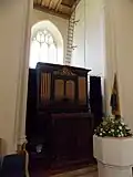 Church organ within tower arch