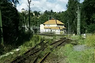 The former Stocksund station, view from southwest. Service in the station building ceased in the 1970s and the station was moved from this location in 1996, but as of 2013, the building remains active.