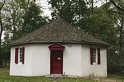 The octagonal school next to the meetinghouse.