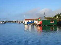 Picture of boatsheds and reflections on water