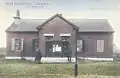 Old Brick Schoolhouse c. 1910, once located near Pine Hill Cemetery