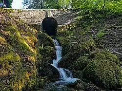 a stone bridge over a stream
