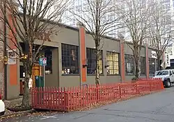 A classic, brown-themed, two-story building, with a sign reading "BRIX" at the top of the entrance