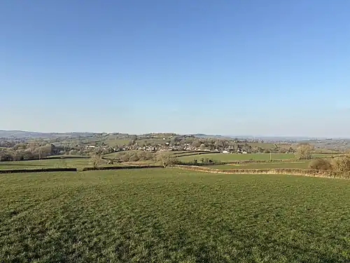 A sunny shot of Broadwindsor in Dorset from the slopes of the nearby Lewesdon Hill, the highest point in Dorset