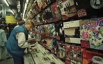 Image 20A young man browsing through a record store in Bonn, West Germany, June 1988 (from Album era)