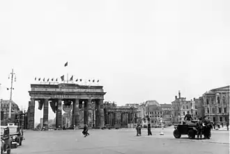 Photo of a British armored car in front of the Bradenburg Gate in Berlin in 1950.