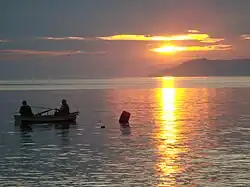 Two fishermen on a boat in the gulf