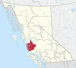 A map of British Columbia depicting its 29 regional districts and equivalent municipalities. One is highlighted in red.