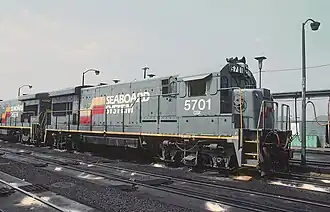 EMD Blomberg B trucks on a GE U36B