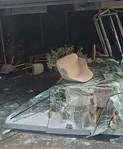 The remains of the destroyed cafe Klasik, which had chairs thrown through its windows.