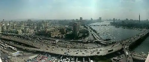 The 6th October Bridge, ramps, and Nile; with Downtown Cairo and Egyptian Museum (on left), in view north from Ramses Hilton
