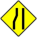Road narrows on the left