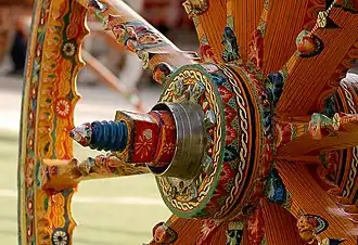 Highly carved and painted wheel