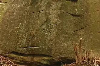 Rock carving created by convict work gang, probably around 1829; it is only a short distance from the beginning of the Great North Road at Parramatta Road
