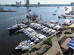 A number of boats in a harbor