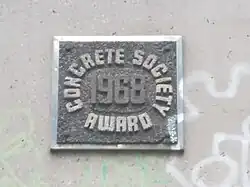 Concrete Society 1968 Award on the side of the Mancunian Way elevated motorway, Manchester, England