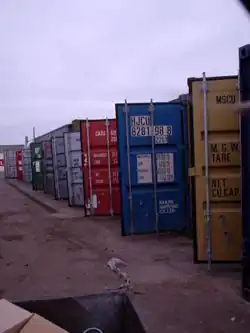 ISO-code and dimension/load table on several newly washed containers