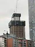 Tower 1 under construction in February 2025