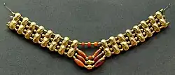 Necklace with gold beads and carnelian beads, Cypriot artwork with Mycenaean inspiration, c. 1400–1200 BC.[citation needed] From Enkomi. British Museum.