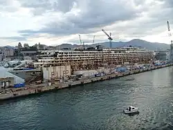 The wreck, with its superstructure being dismantled, in the Superbacino dock in Genoa, 12 September 2015