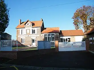 The town hall and echool in Courtemanche