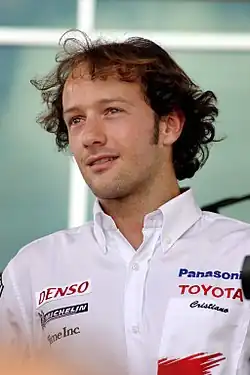 Man in his early thirties looking to the right of the camera.