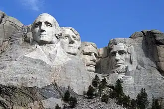 Washington and other figures engraved into the side of a mountain