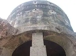 Dome of the Tomb, seen from southern facade, and modern brick-pillar is behind the dome.